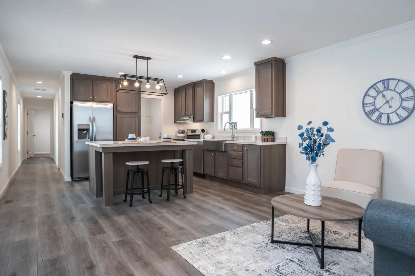 The 5406 "PINEHAVEN" 7616 Living Room. This Manufactured Mobile Home features 3 bedrooms and 2 baths.
