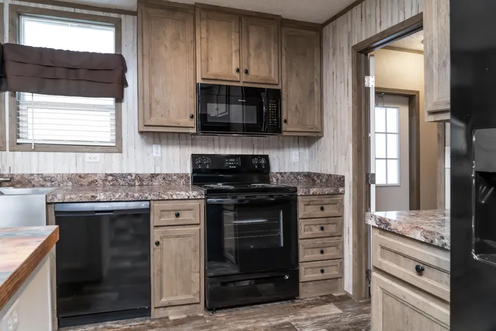 The NUMBER ONE Exterior. This Manufactured Mobile Home features 3 bedrooms and 2 baths.