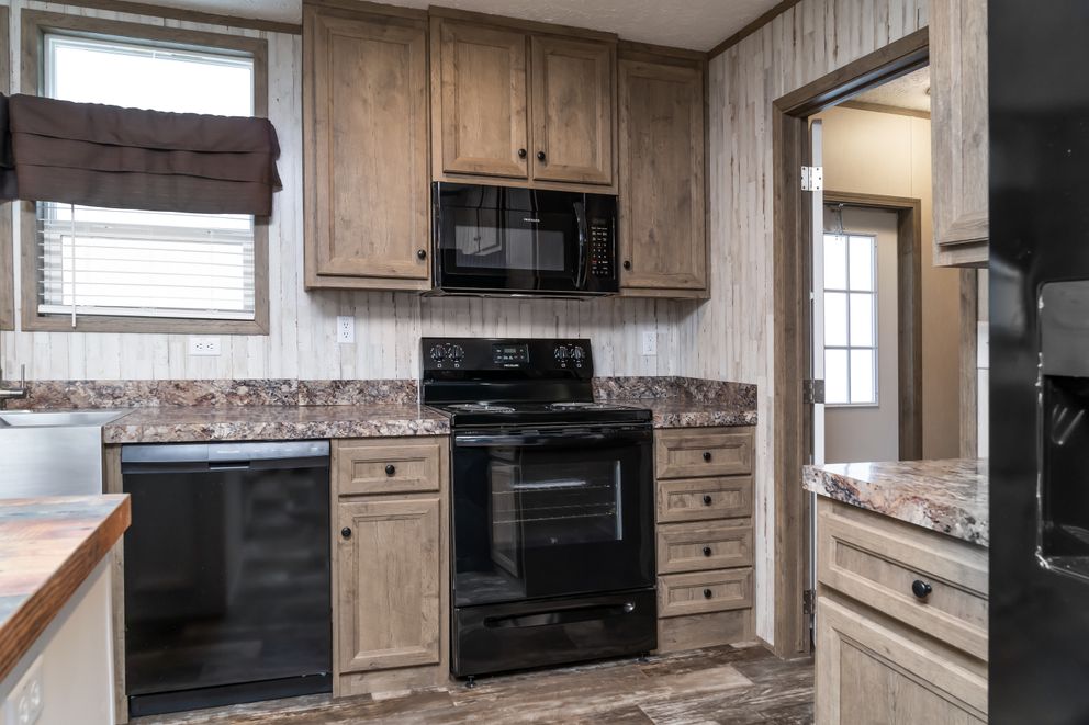 The NUMBER ONE Exterior. This Manufactured Mobile Home features 3 bedrooms and 2 baths.