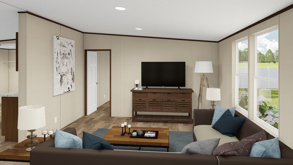 The SATISFACTION Living Room. This Manufactured Mobile Home features 3 bedrooms and 2 baths.