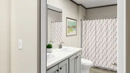 The LEGEND BIG BOY Guest Bathroom. This Manufactured Mobile Home features 4 bedrooms and 2 baths.