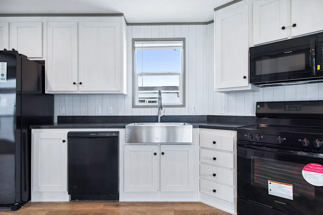 The ANNIVERSARY 16682F Kitchen. This Manufactured Mobile Home features 2 bedrooms and 2 baths.