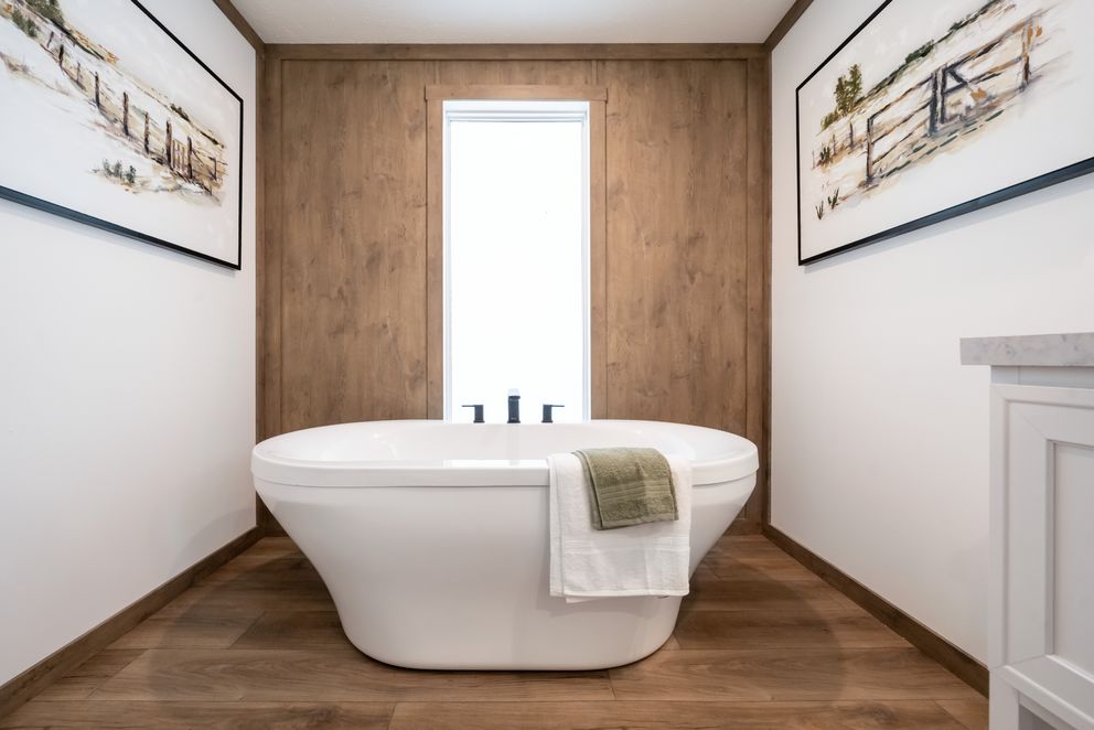 The THE LIZZIE Primary Bathroom. This Manufactured Mobile Home features 3 bedrooms and 2 baths.