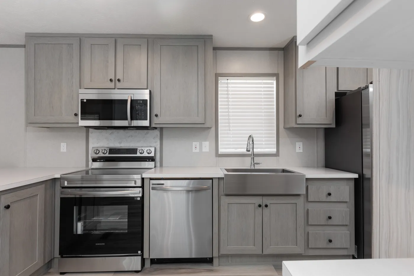 The THE ANNIVERSARY 76 Kitchen. This Manufactured Mobile Home features 3 bedrooms and 2 baths.