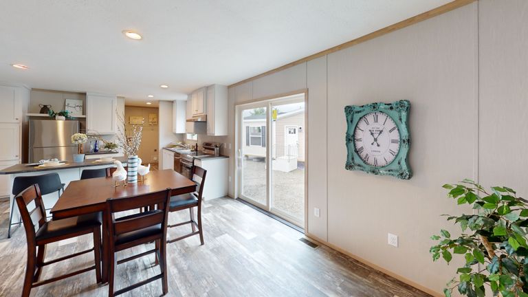 The HANCOCK Dining Room. This Manufactured Mobile Home features 4 bedrooms and 2 baths.