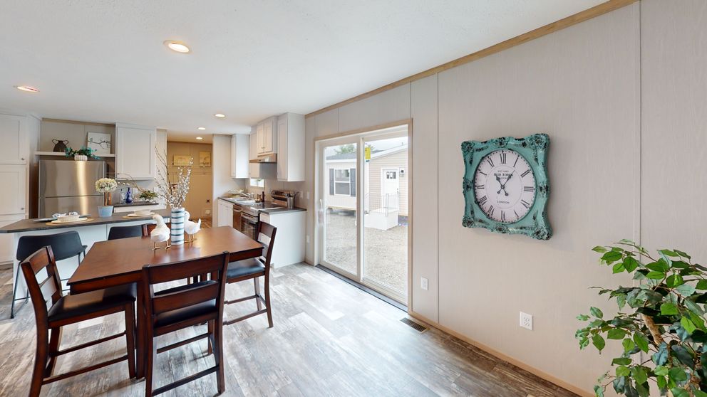 The HANCOCK Dining Room. This Manufactured Mobile Home features 4 bedrooms and 2 baths.