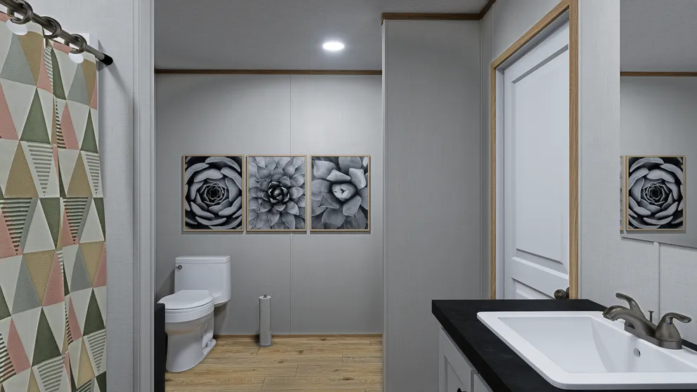 The ECLIPSE Primary Bathroom. This Manufactured Mobile Home features 4 bedrooms and 2 baths.
