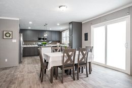The THE FUSION 32B Dining Area. This Manufactured Mobile Home features 4 bedrooms and 2 baths.