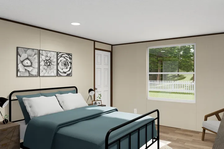 The SPLENDOR Primary Bedroom. This Manufactured Mobile Home features 3 bedrooms and 2 baths.