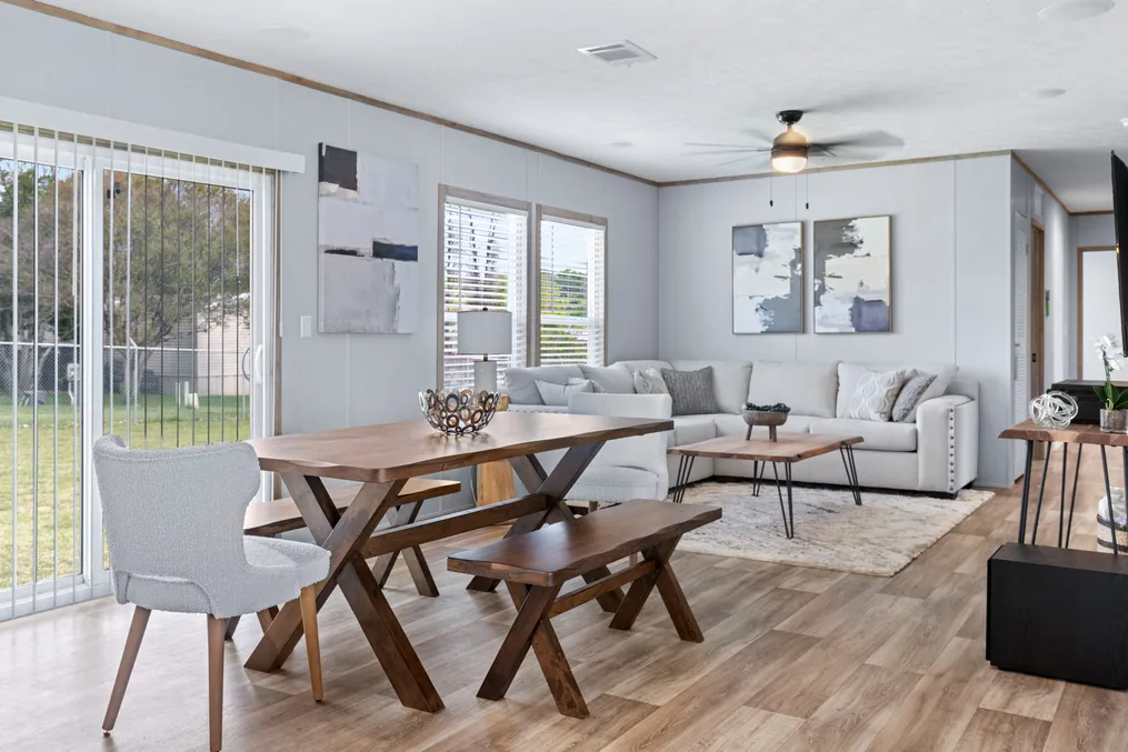 The EL SUENO BREEZE Dining Area. This Manufactured Mobile Home features 4 bedrooms and 2 baths.