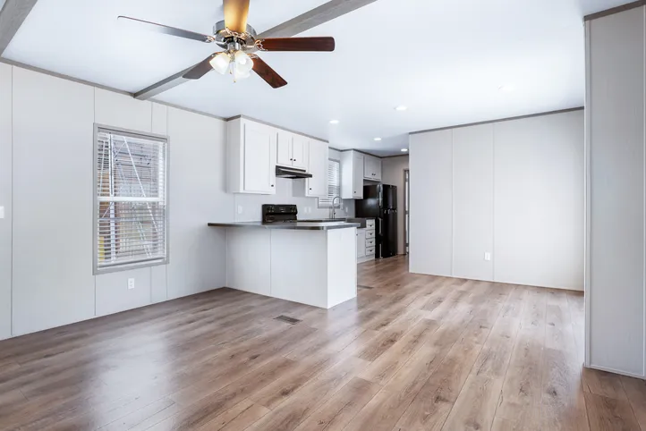 The ANNIVERSARY 16602A Living Room. This Manufactured Mobile Home features 2 bedrooms and 2 baths.