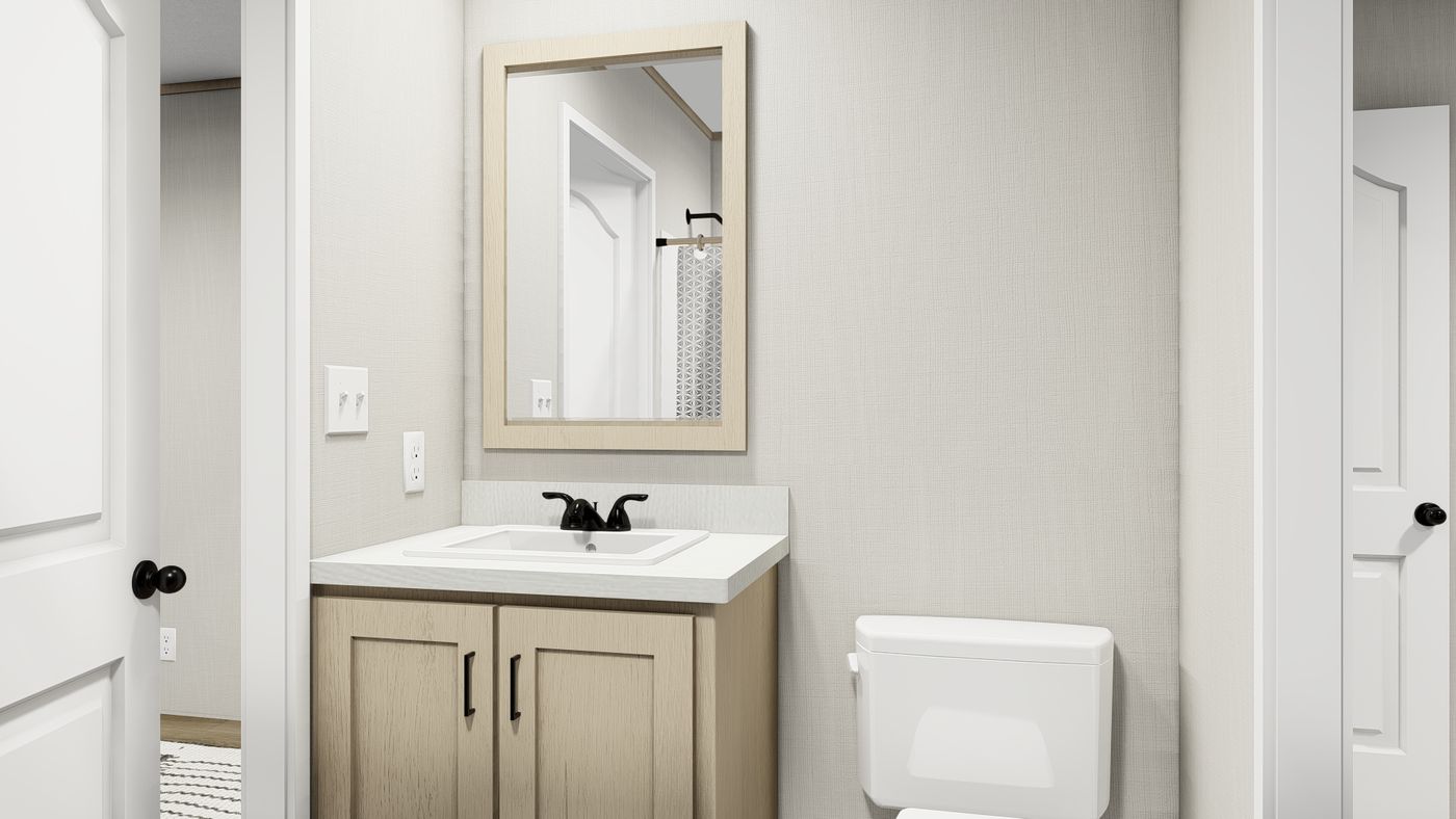 The KING AIR Guest Bathroom. This Manufactured Mobile Home features 4 bedrooms and 2 baths.