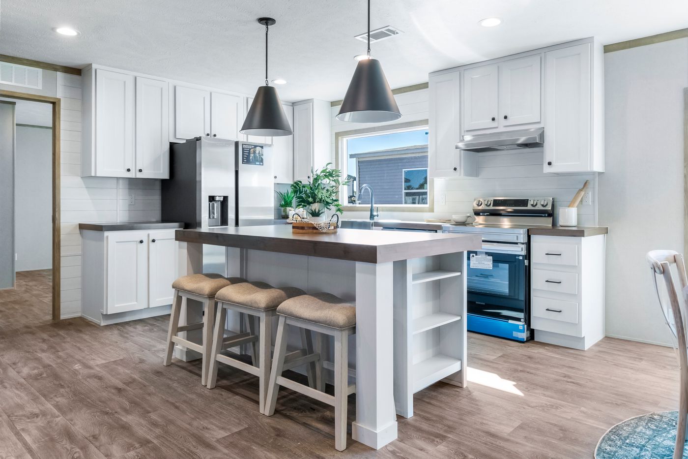 The THE BIG DEAL 52 Kitchen. This Manufactured Mobile Home features 3 bedrooms and 2 baths.