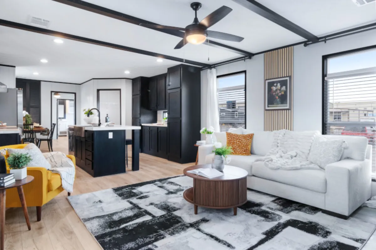 The ANNIVERSARY 16763S Living Room. This Manufactured Mobile Home features 3 bedrooms and 2 baths.