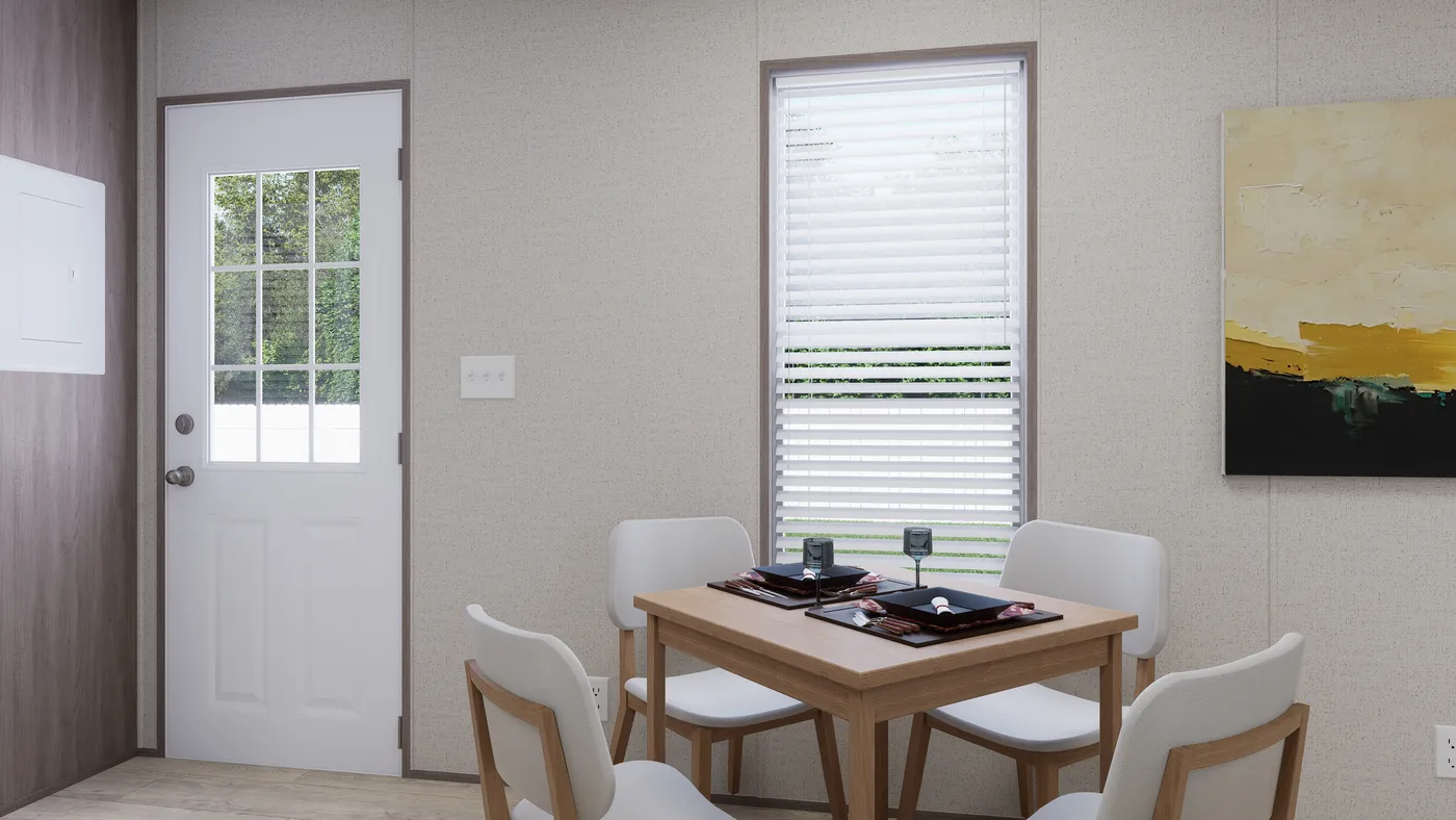 The GLACIER RIDGE Dining Area. This Manufactured Mobile Home features 2 bedrooms and 1 bath.