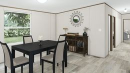 The TRIUMPH Dining Area. This Manufactured Mobile Home features 5 bedrooms and 3 baths.
