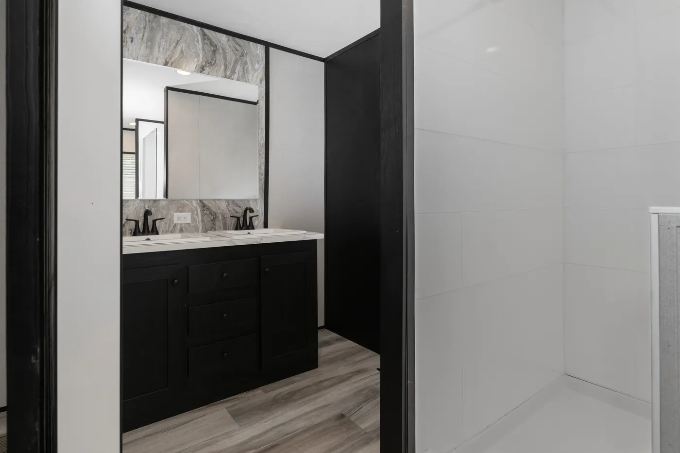 The THE SMOKEY Primary Bathroom. This Manufactured Mobile Home features 3 bedrooms and 2 baths.