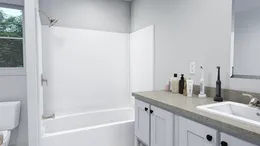 The LOVELY DAY Guest Bathroom. This Manufactured Mobile Home features 4 bedrooms and 2 baths.