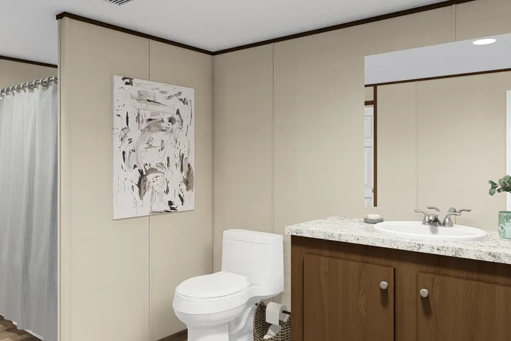 The TRIUMPH Primary Bathroom. This Manufactured Mobile Home features 5 bedrooms and 3 baths.