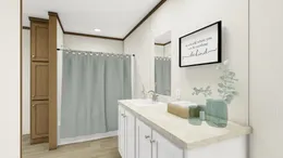 The THE REVEAL Primary Bathroom. This Manufactured Mobile Home features 3 bedrooms and 2 baths.