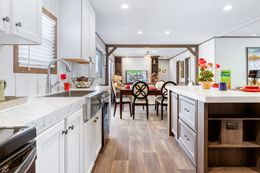 The THE SUNDOWNER Kitchen. This Manufactured Mobile Home features 3 bedrooms and 2 baths.