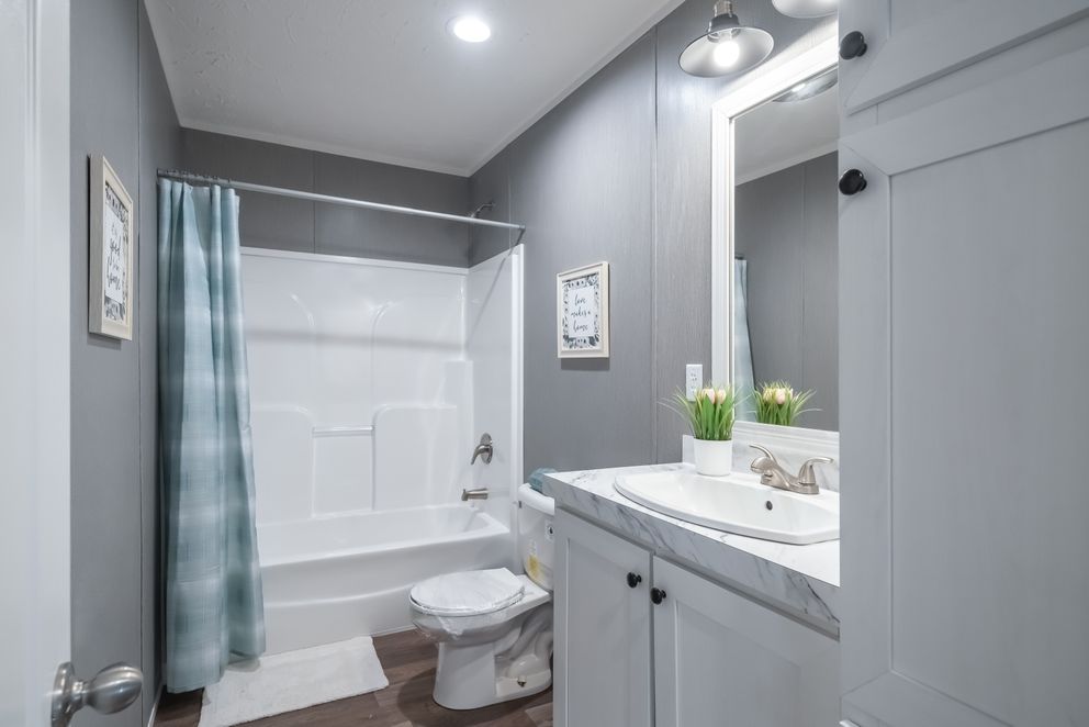 The TRADITION 3268B Guest Bathroom. This Manufactured Mobile Home features 5 bedrooms and 3 baths.