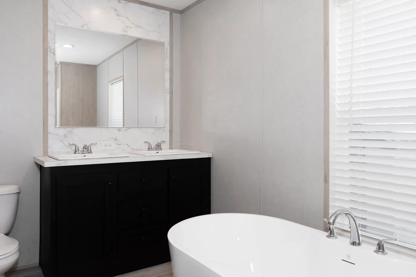 The THE THUNDERHEAD Primary Bathroom. This Manufactured Mobile Home features 3 bedrooms and 2 baths.