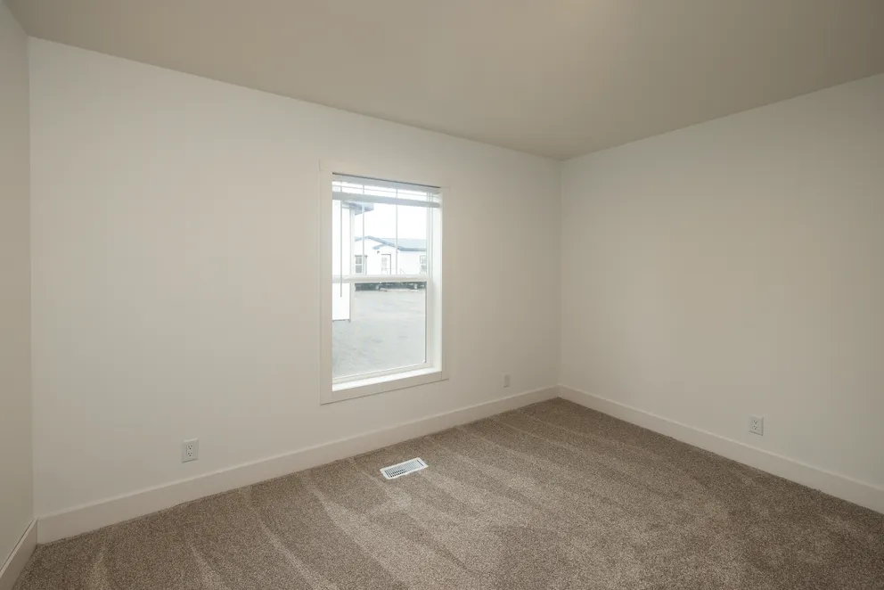 The HEY JUDE Bedroom. This Manufactured Mobile Home features 4 bedrooms and 2 baths.