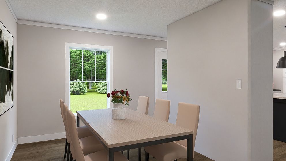The SHOUT Dining Room. This Manufactured Mobile Home features 3 bedrooms and 2 baths.