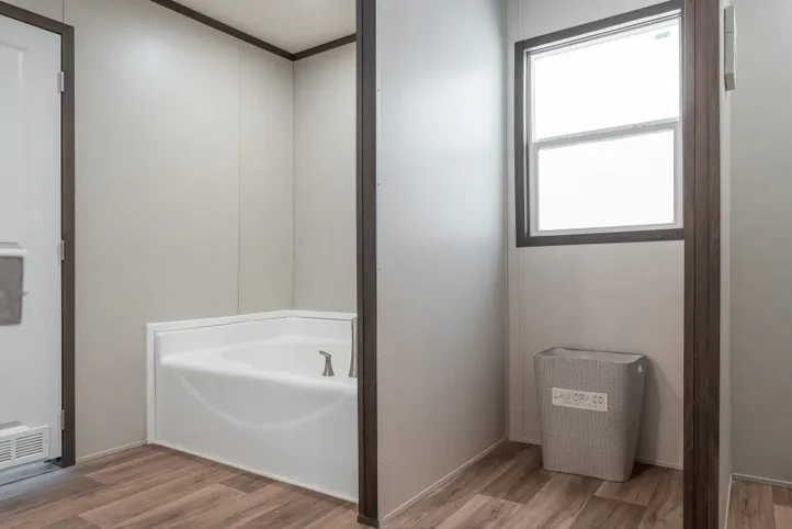 The EMPOWER Primary Bathroom. This Manufactured Mobile Home features 4 bedrooms and 2 baths.