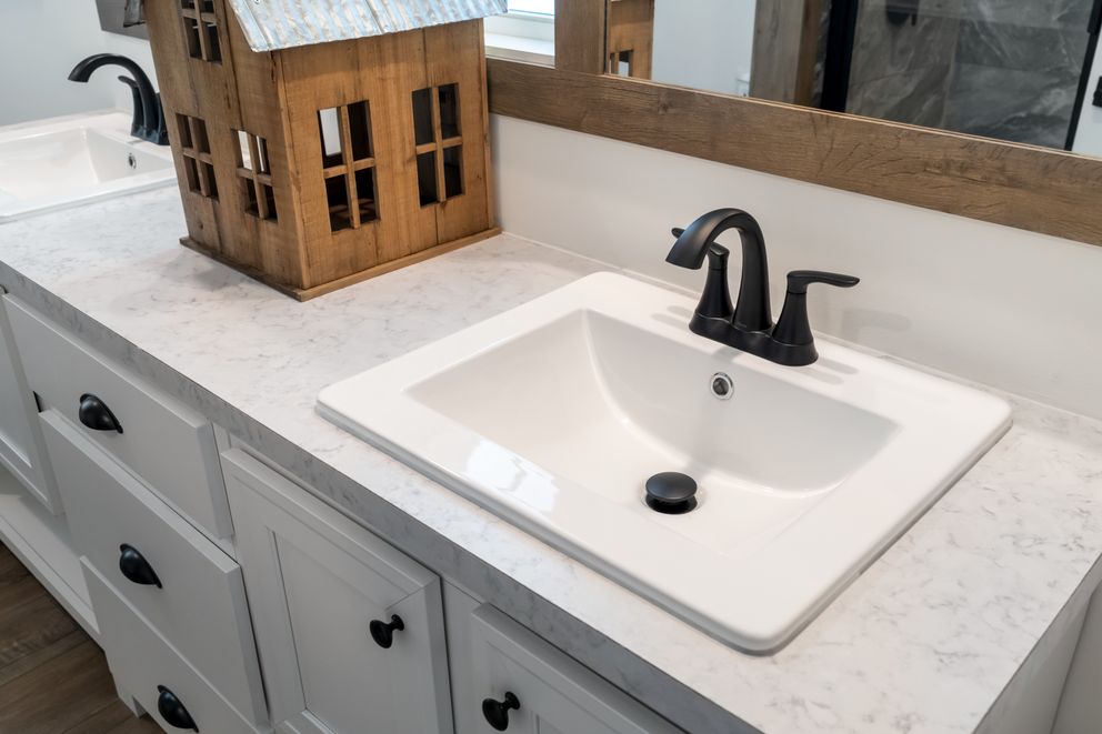 The THE LIZZIE Primary Bathroom. This Manufactured Mobile Home features 3 bedrooms and 2 baths.