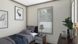 The 7616-4700 THE PULSE Guest Bedroom. This Manufactured Mobile Home features 3 bedrooms and 2 baths.