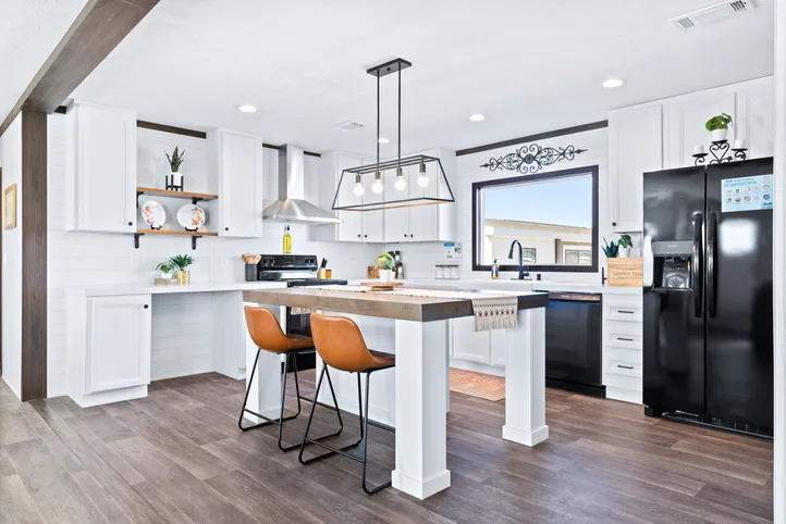 The BREEZE FARMHOUSE Kitchen. This Manufactured Mobile Home features 3 bedrooms and 2 baths.