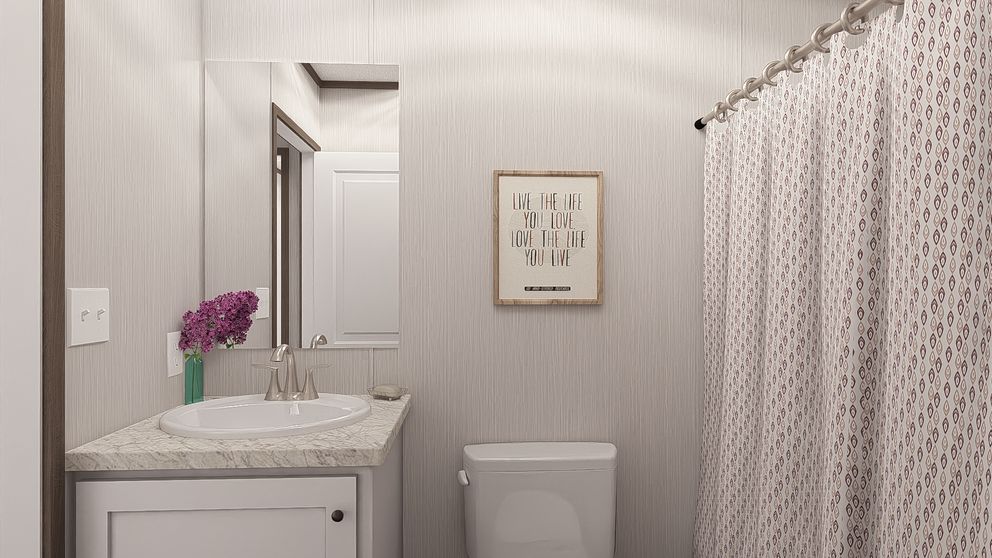 The LEGEND ANNIVERSARY 16X76 Guest Bathroom. This Manufactured Mobile Home features 3 bedrooms and 2 baths.