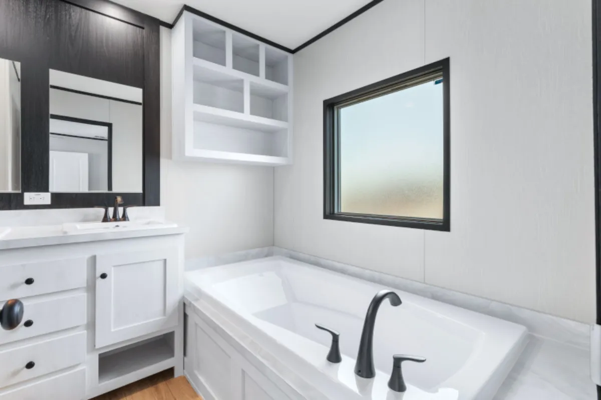 The ANNIVERSARY 16763S Primary Bathroom. This Manufactured Mobile Home features 3 bedrooms and 2 baths.