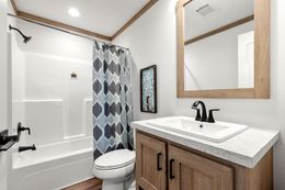 The LIZZIE Guest Bathroom. This Manufactured Mobile Home features 3 bedrooms and 2 baths.