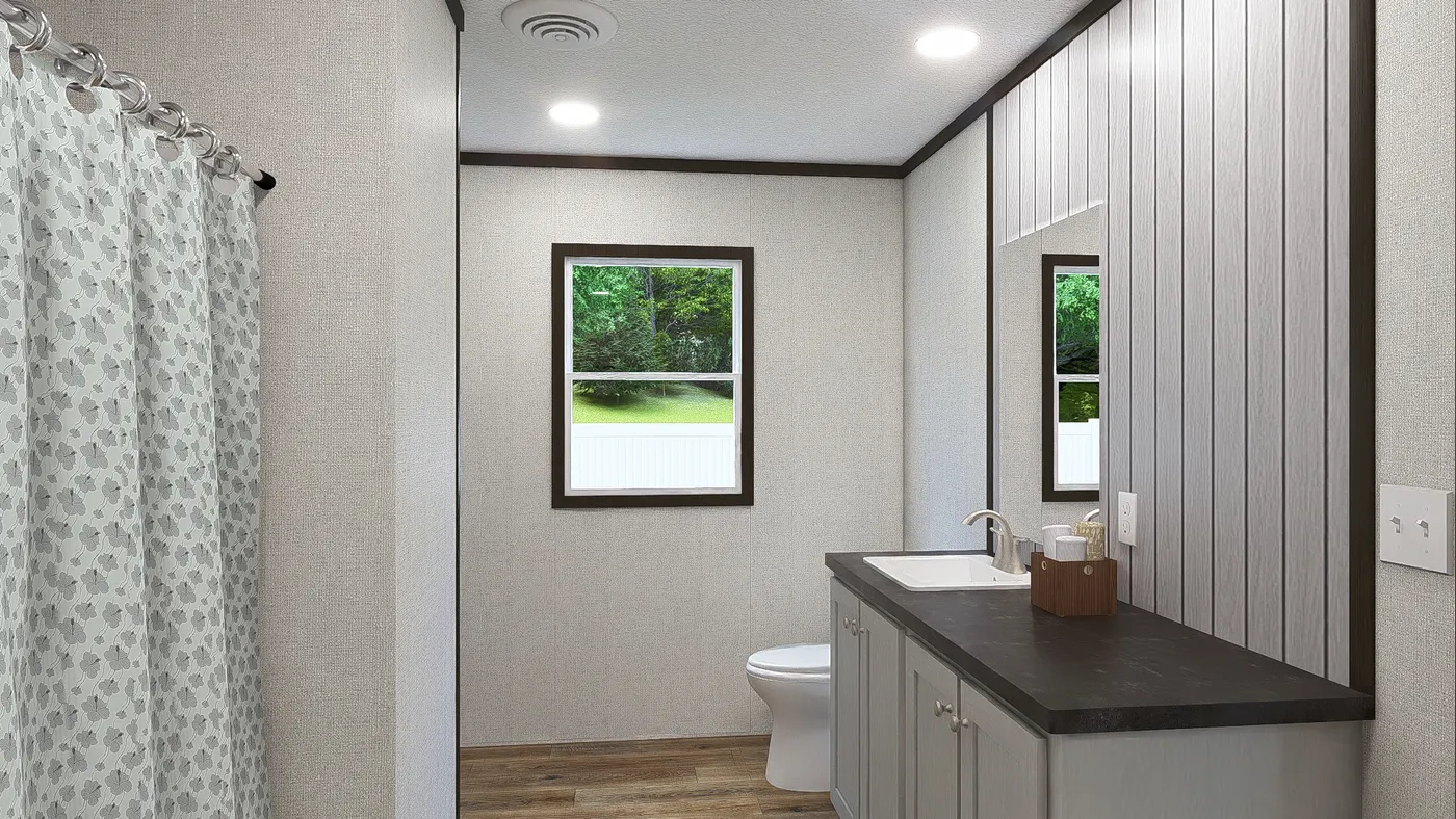 The FESTIVAL Primary Bathroom. This Manufactured Mobile Home features 3 bedrooms and 2 baths.
