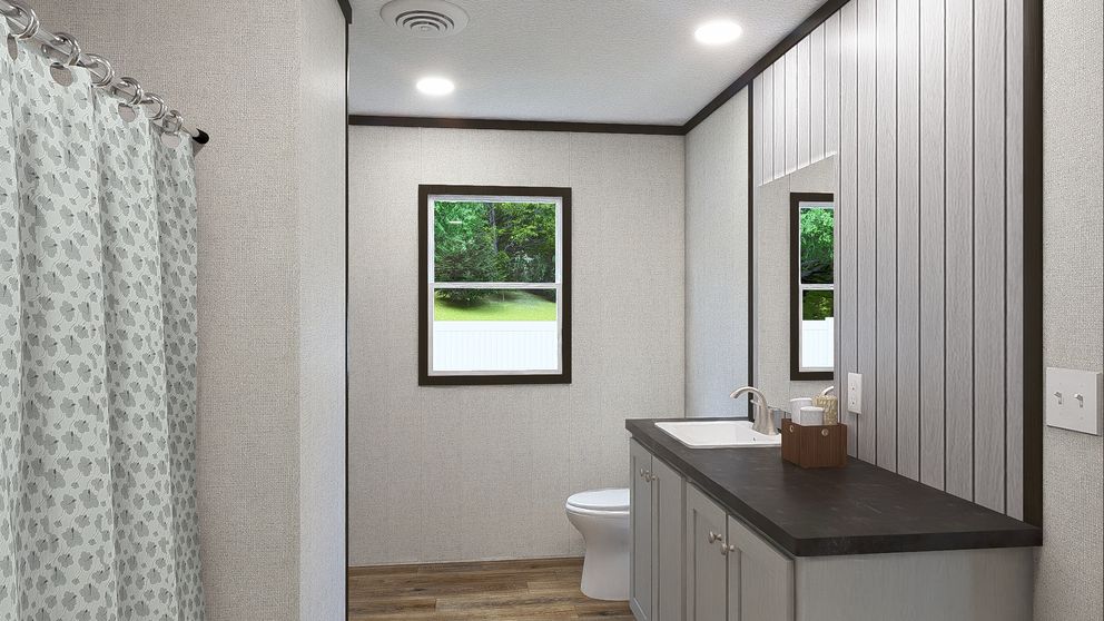 The FESTIVAL Primary Bathroom. This Manufactured Mobile Home features 3 bedrooms and 2 baths.