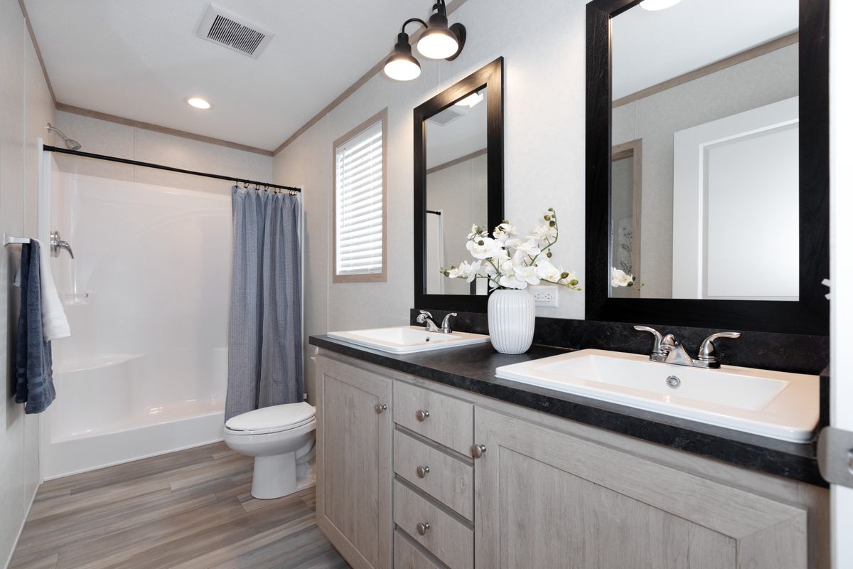 The 5628-5202 ADRENALINE Primary Bathroom. This Manufactured Mobile Home features 3 bedrooms and 2 baths.