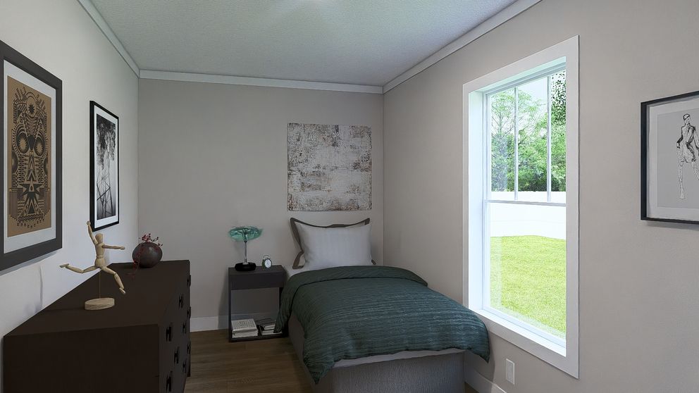 The STILL THE ONE Guest Bedroom. This Manufactured Mobile Home features 2 bedrooms and 2 baths.