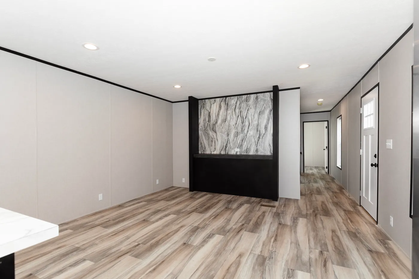 The THE FUJI Living Room. This Manufactured Mobile Home features 3 bedrooms and 2 baths.