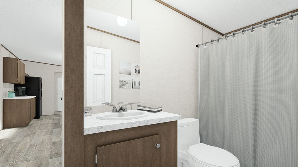The THRILL Guest Bathroom. This Manufactured Mobile Home features 3 bedrooms and 2 baths.