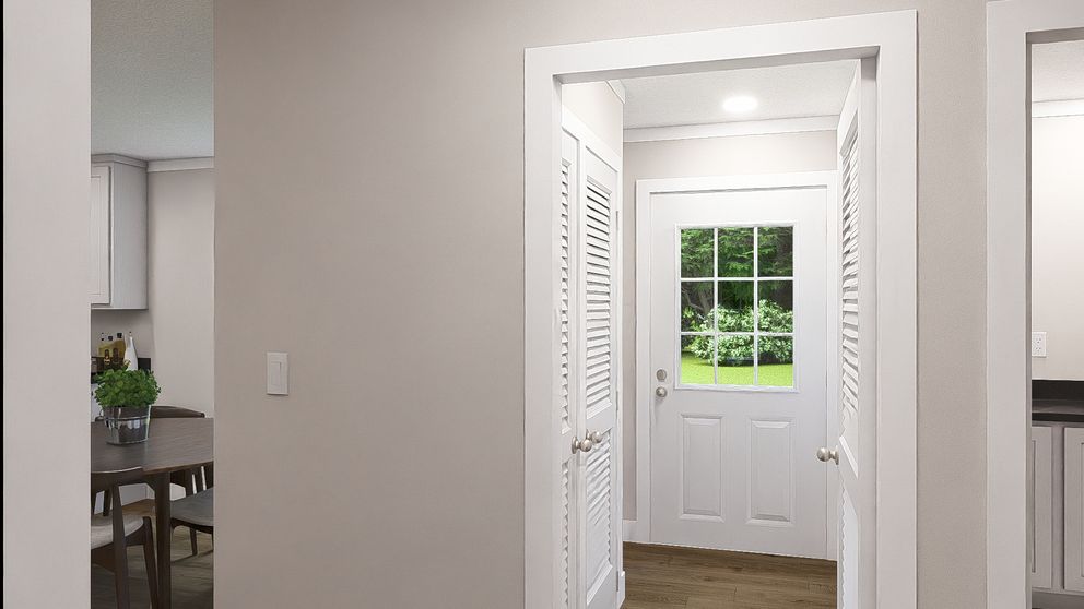 The WONDERFUL WORLD Foyer. This Manufactured Mobile Home features 3 bedrooms and 2 baths.