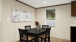 The SATISFACTION Dining Room. This Manufactured Mobile Home features 3 bedrooms and 2 baths.