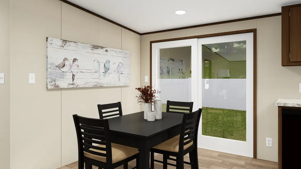 The SATISFACTION Dining Area. This Manufactured Mobile Home features 3 bedrooms and 2 baths.