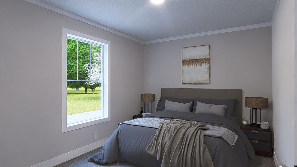 The LEAN ON ME Guest Bedroom. This Manufactured Mobile Home features 3 bedrooms and 2 baths.