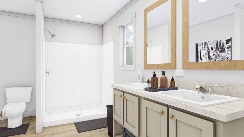 The STAYIN ALIVE Primary Bathroom. This Modular Home features 3 bedrooms and 2 baths.