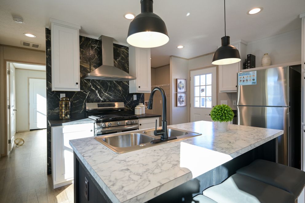 The TIGER'S EYE 7416-456 Kitchen. This Manufactured Mobile Home features 3 bedrooms and 2 baths.