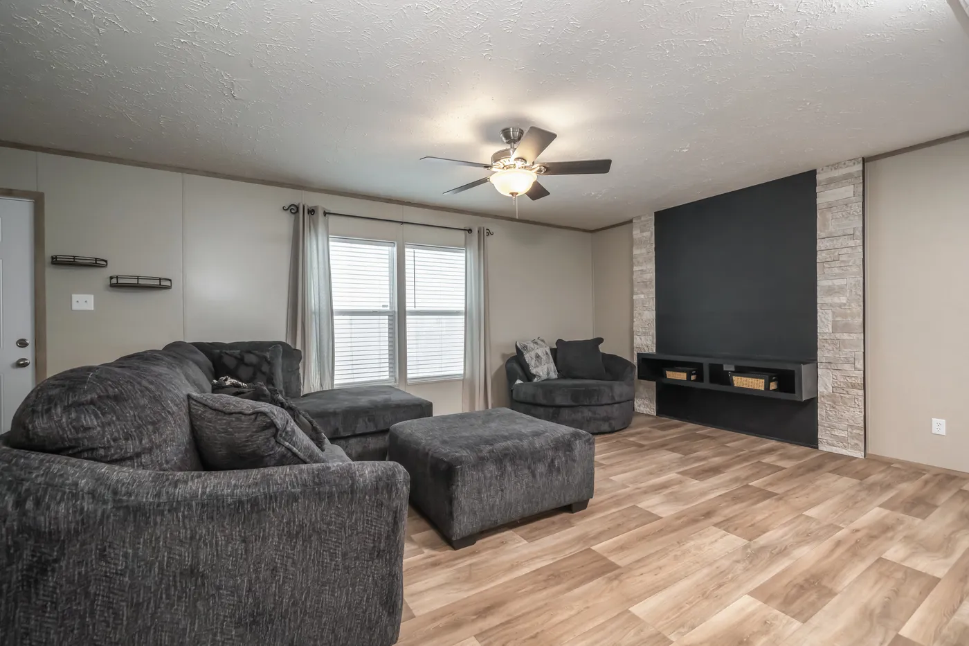 The TRADITION 72 Living Room. This Manufactured Mobile Home features 3 bedrooms and 2 baths.