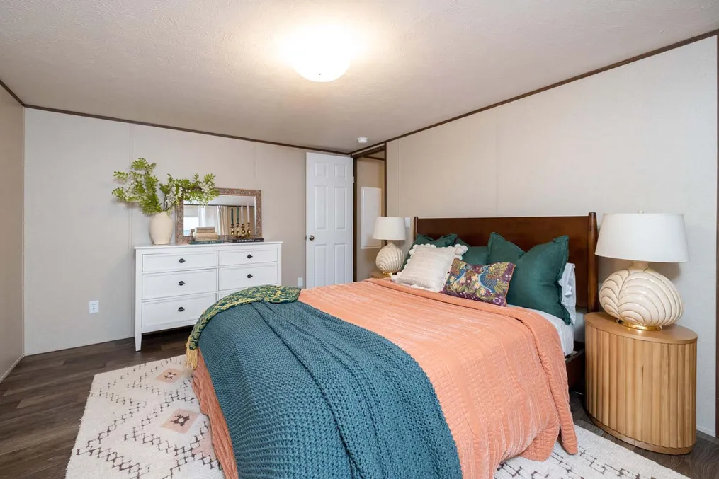 The CELEBRATION Primary Bedroom. This Manufactured Mobile Home features 3 bedrooms and 2 baths.